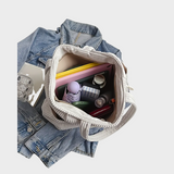 Amalija – Gestreifte Tasche mit Details aus Seil