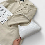 Bernarda - Glänzende Lederhandtasche